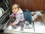 Little Estelle in the dishwasher
